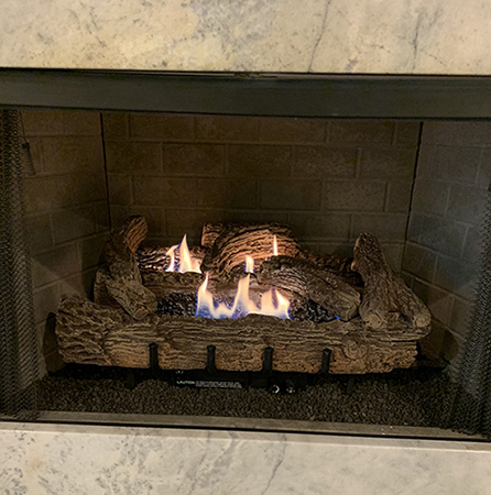 Burning fireplace - Ashbusters Chimney