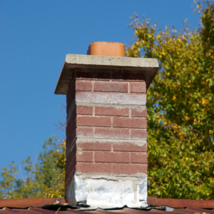 chimney in rough shape with discolored brick and loose flashing