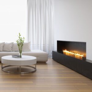 living room with white furniture and a lit wide gas fireplace
